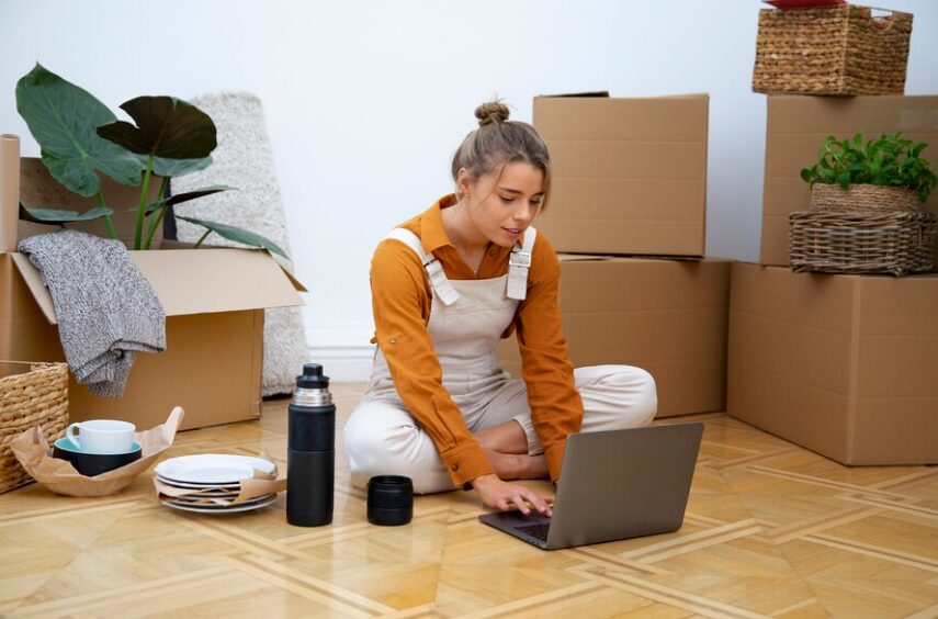 Home Based Business Setup - A desk with a laptop, notebook, and office supplies, symbolizing the process of setting up a home-based business.